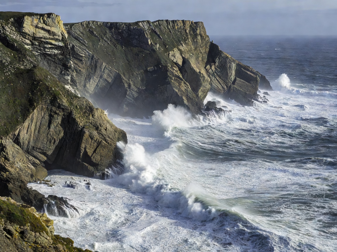 Sheer sea cliffs dropping into the churn of the Atlantic Ocean at Cabo da Roca